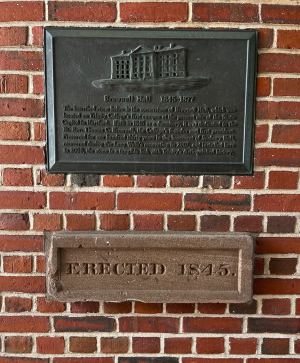 The Brownell Hall cornerstone, mounted in [[downes_clock_tower|Downes Clock Tower]]. Photo Credit: Amanda Matava